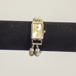 Watch with an elegant, square, gold watch face.